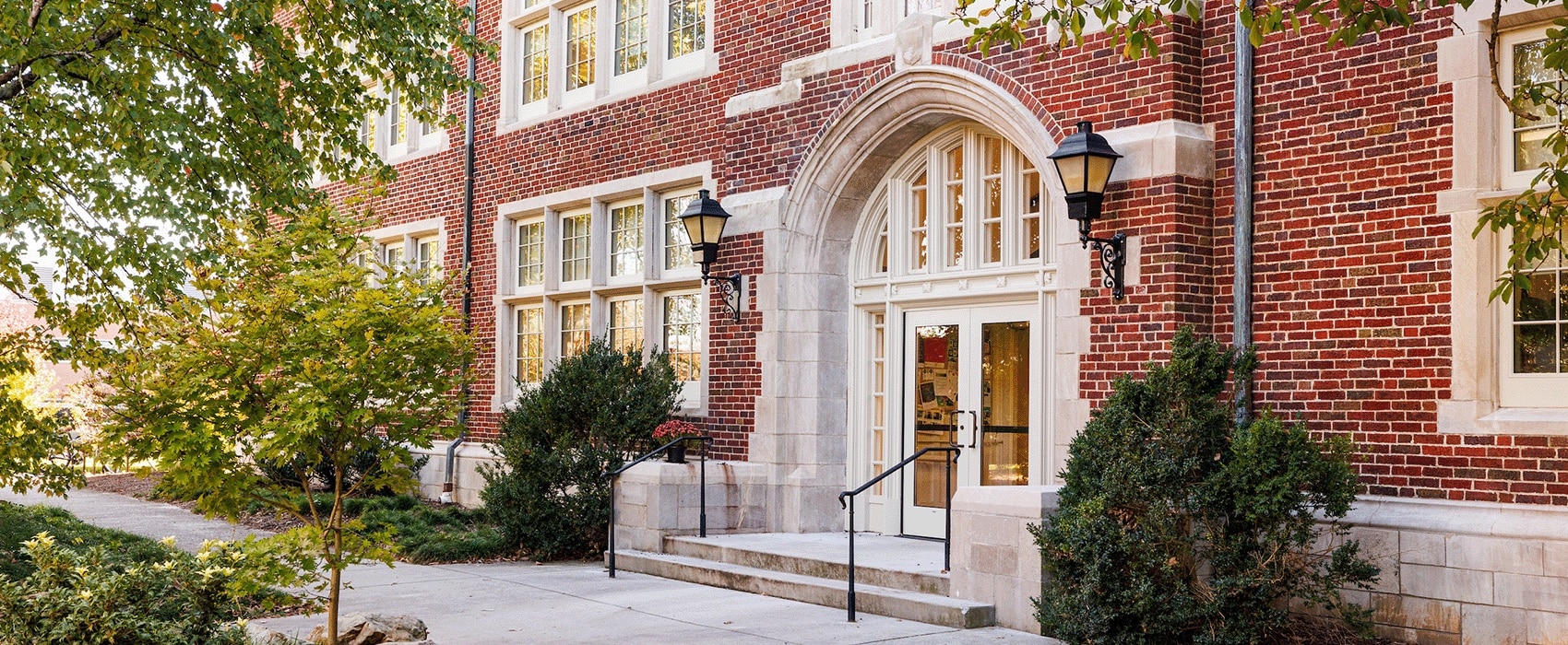 Side angle of the side doors of Morgan Hall, a large, brick administrative building.