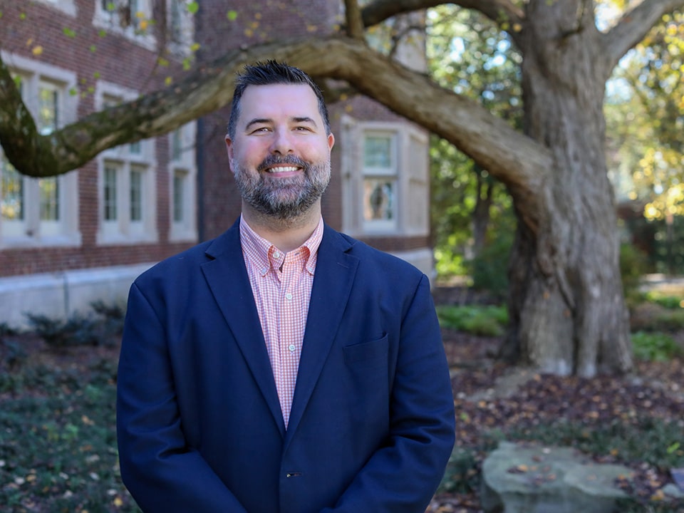 Headshot of Andrew Hart outside Morgan Hall.