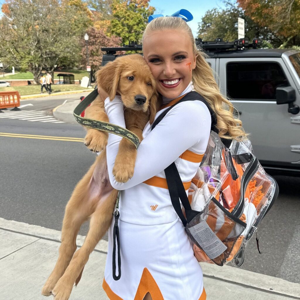 Livvy holding a puppy