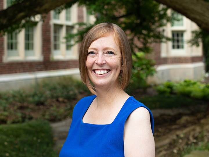 Headshot of Cora Ripley outside Morgan Hall.