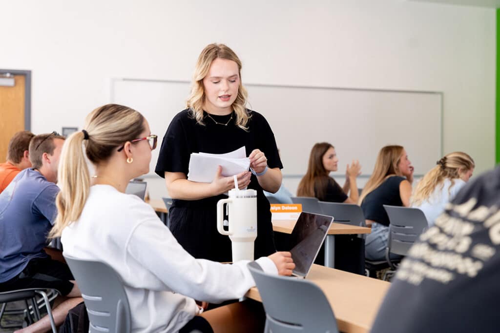 Advisor Ally Lay hands out papers during class in the Agriculture and Natural Resources Building (ANR) on the University of Tennessee Ag Campus on on September 10, 2025. Photo by Raffe Lazarian / UTIA