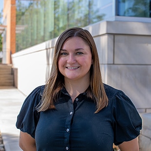 Headshot of Mackenzie Furches outside the Agriculture and Natural Resources Building.