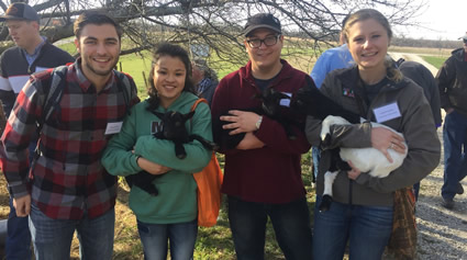 IASA members pose with cuddly small animals