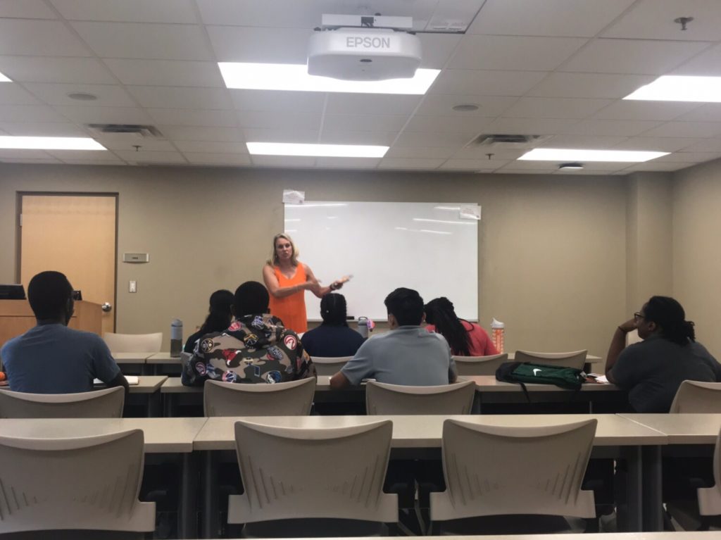 Dr. Stephens teaching a leadership lesson to Herbert College Connections students.