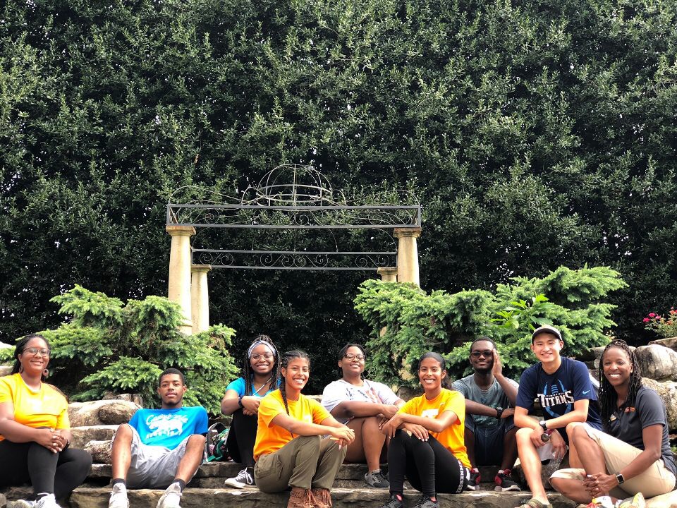 Herbert College Connections group taking photos in the UT gardens.