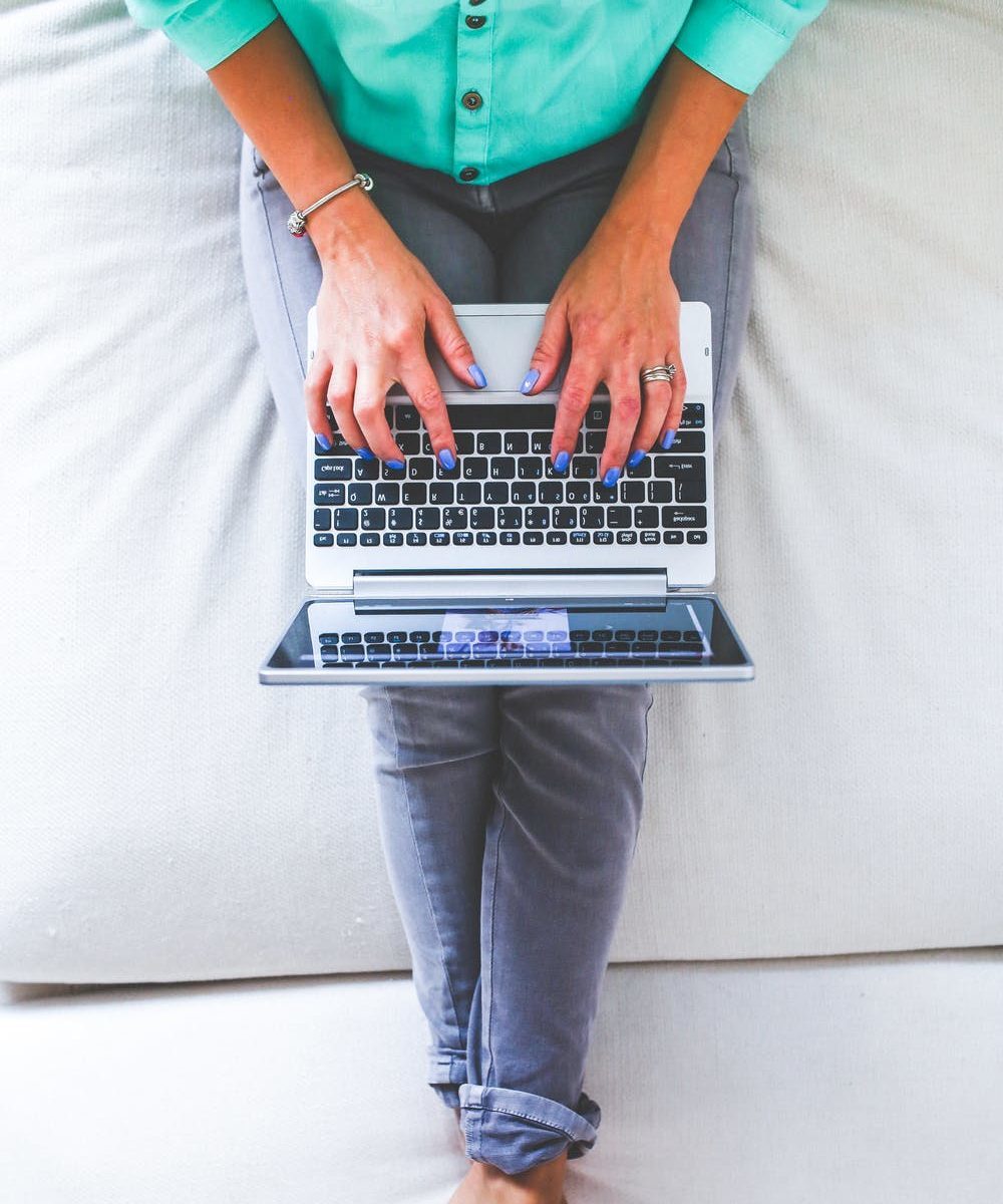 person sitting and working on laptop 