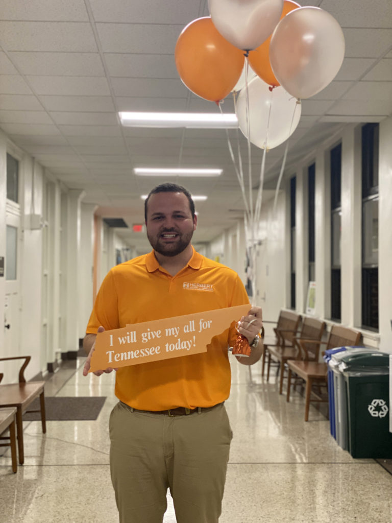 John Calvin Bryant hold a, "I will give my all for Tennessee Today" sign. 