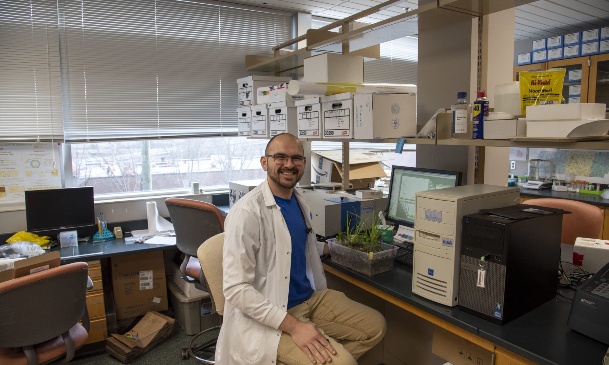 PhD student Rob Sears sitting in lab conducting research