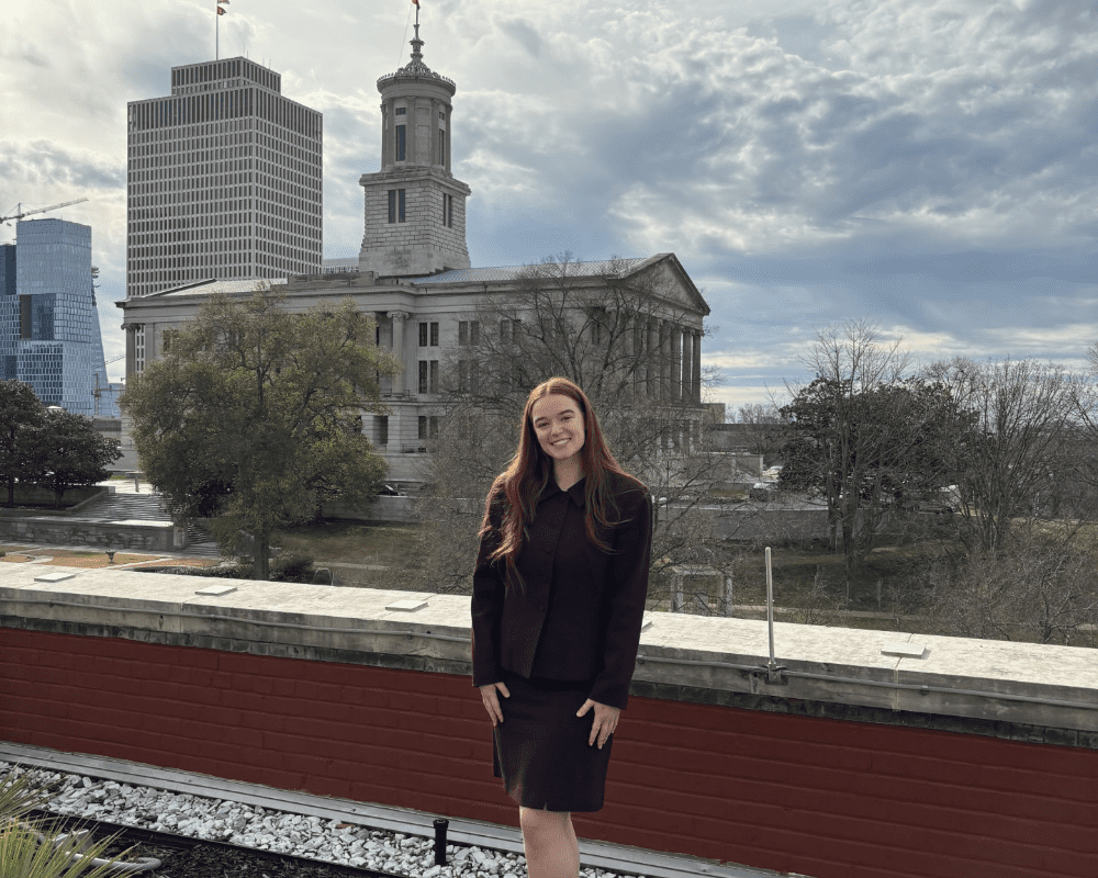 Genevieve Krass posing in front of the TN state capital building