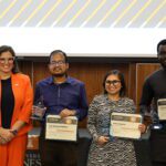 Food science graduate student Kriza Calumba (third from left) after winning the Three Minute Thesis final, pictured with Vice Provost and Dean of the Graduate School Marieke Van Puymbroeck (far left) and fellow presenters.