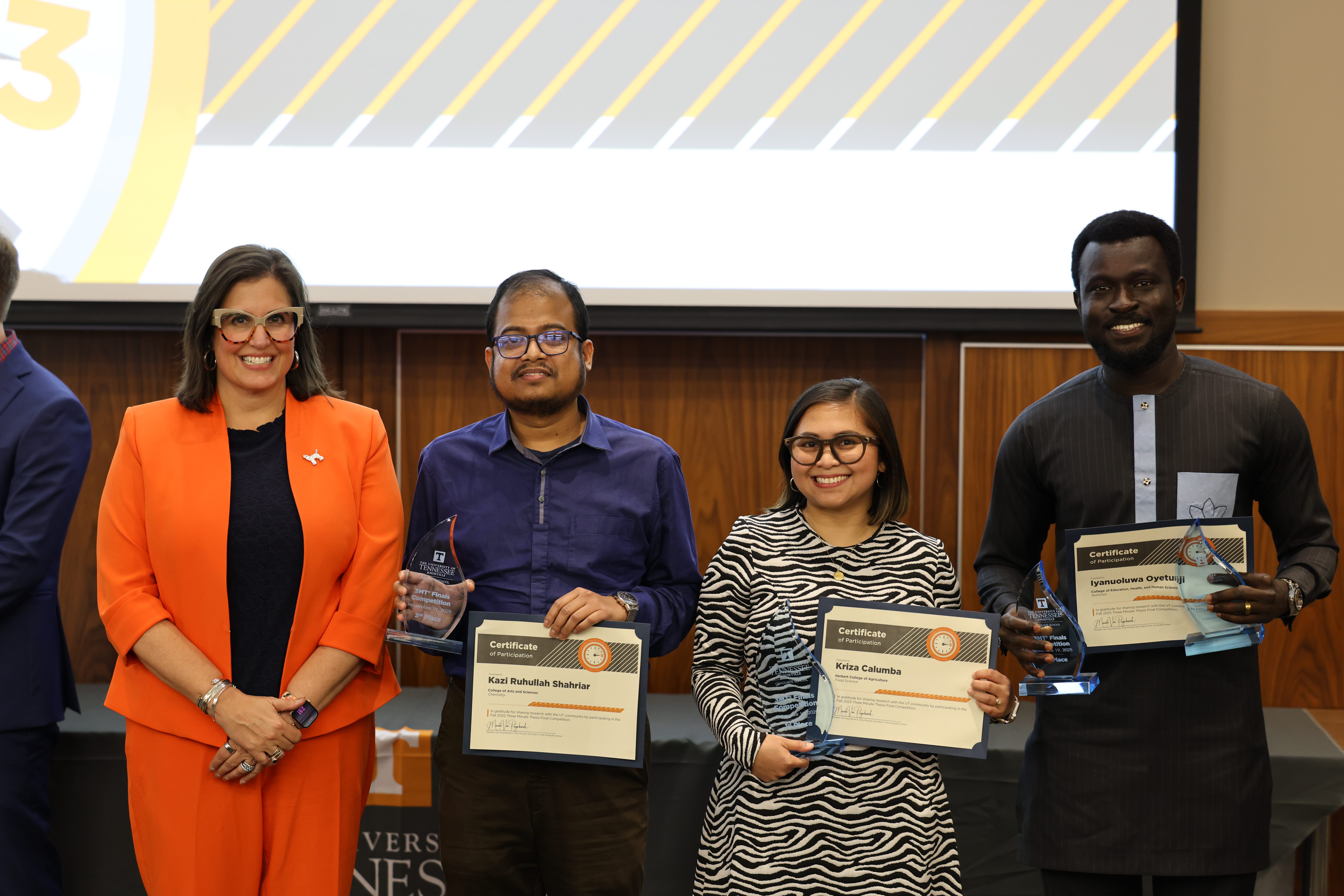 Food science graduate student Kriza Calumba (third from left) after winning the Three Minute Thesis final, pictured with Vice Provost and Dean of the Graduate School Marieke Van Puymbroeck (far left) and fellow presenters.