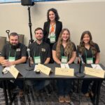 Herbert students (left to right): Sam Jones, Linus Parrish, Callie Rule, and Maggie Lindsey, sitting at a table at the National Forage Bowl Competition.